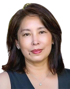 Professional portrait of a middle-aged woman with shoulder-length hair.