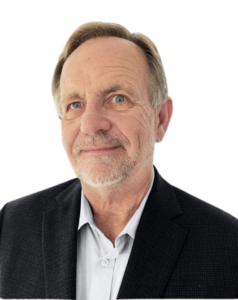 Portrait of a confident older man in a suit jacket.